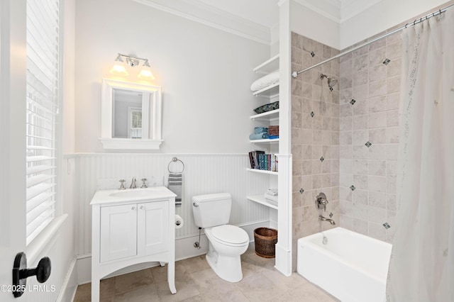 bathroom with shower / bath combo, wainscoting, vanity, and crown molding