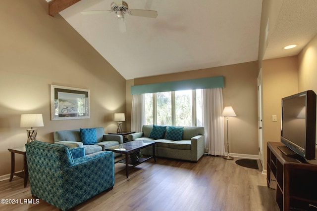 living room with ceiling fan, hardwood / wood-style flooring, high vaulted ceiling, and beamed ceiling