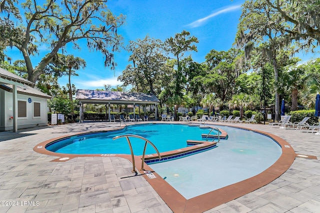 view of swimming pool featuring a patio area