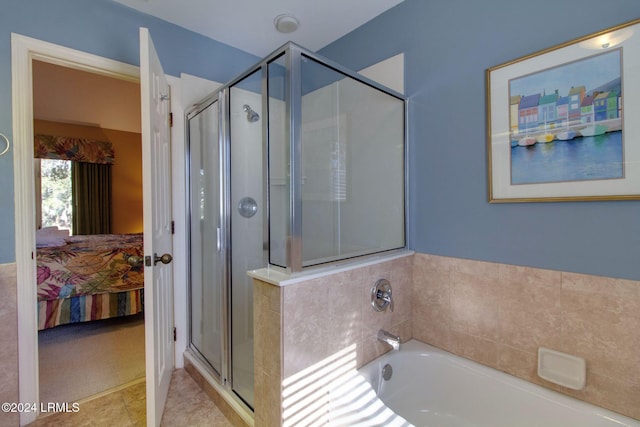 bathroom with tile patterned floors and a shower with shower door