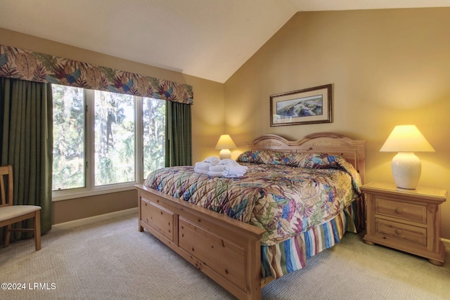 carpeted bedroom with vaulted ceiling