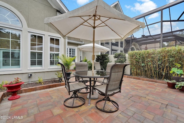 view of patio / terrace with a lanai