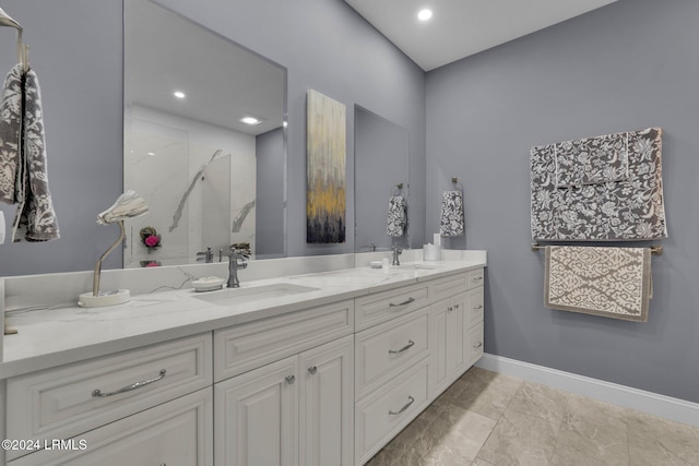 bathroom with vanity and a shower