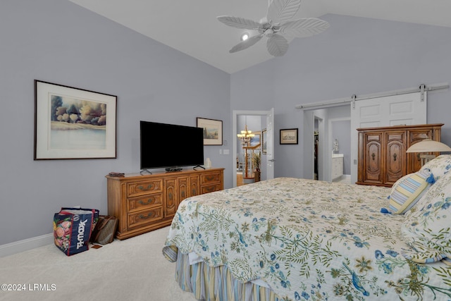 bedroom with lofted ceiling, connected bathroom, carpet floors, ceiling fan with notable chandelier, and a barn door