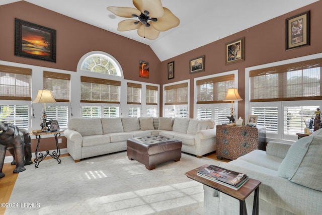 living room featuring ceiling fan and vaulted ceiling