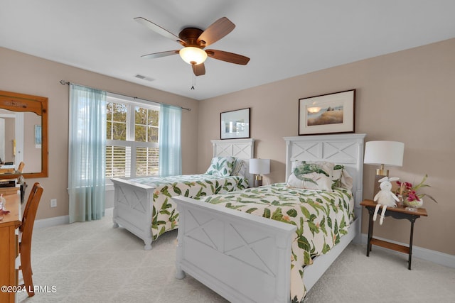 bedroom with light colored carpet and ceiling fan