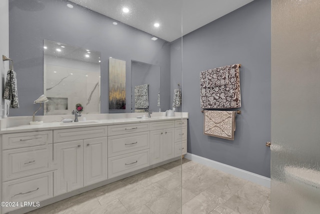 bathroom with vanity and walk in shower