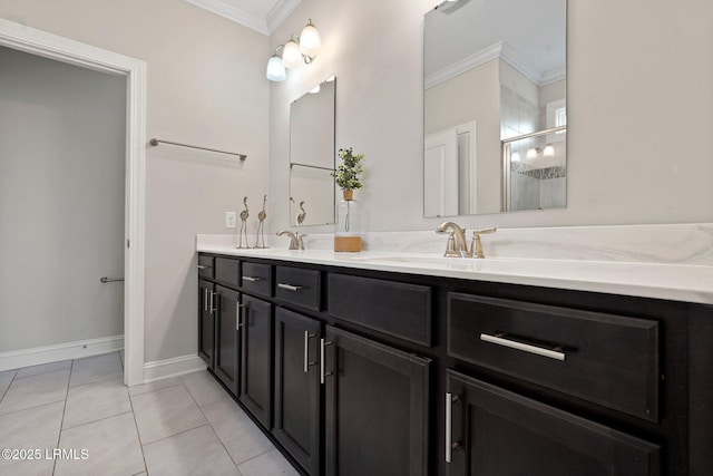 bathroom featuring a sink, a stall shower, tile patterned flooring, and crown molding