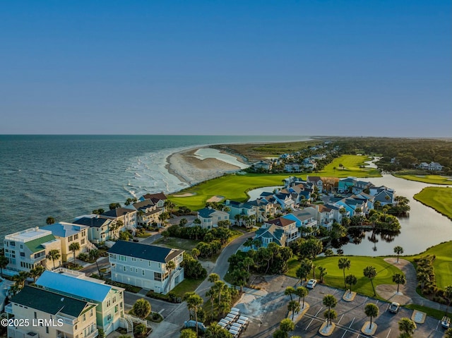 bird's eye view with a water view and view of golf course