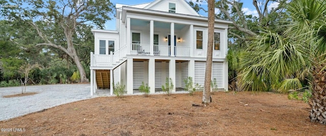 coastal home with a porch and stairway