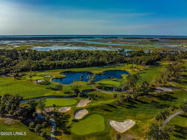 aerial view with golf course view and a water view