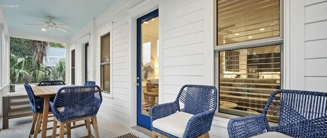 wooden terrace with a porch and ceiling fan