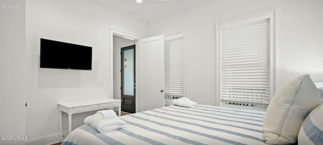 bedroom featuring baseboards