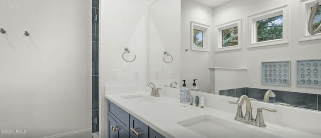 full bath featuring double vanity and a sink