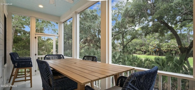 sunroom / solarium with ceiling fan