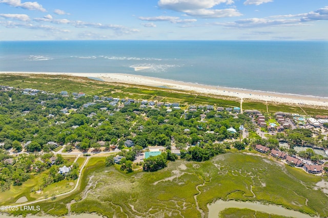 bird's eye view featuring a water view and a beach view
