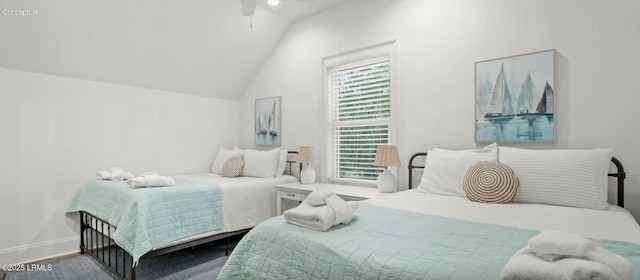 bedroom with vaulted ceiling, ceiling fan, and baseboards