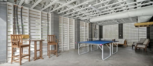 playroom with concrete flooring