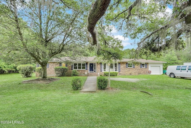 ranch-style house with a garage and a front lawn