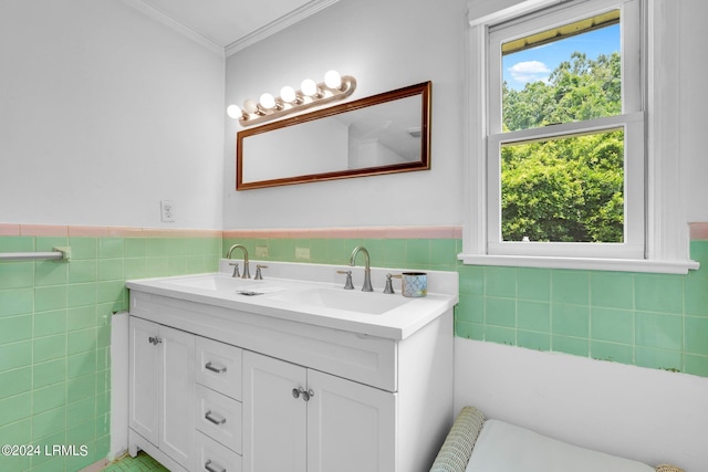 bathroom with vanity, ornamental molding, and tile walls