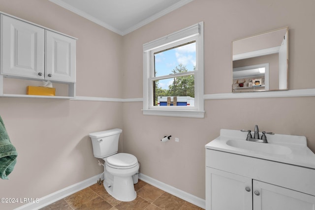 bathroom featuring crown molding, vanity, and toilet