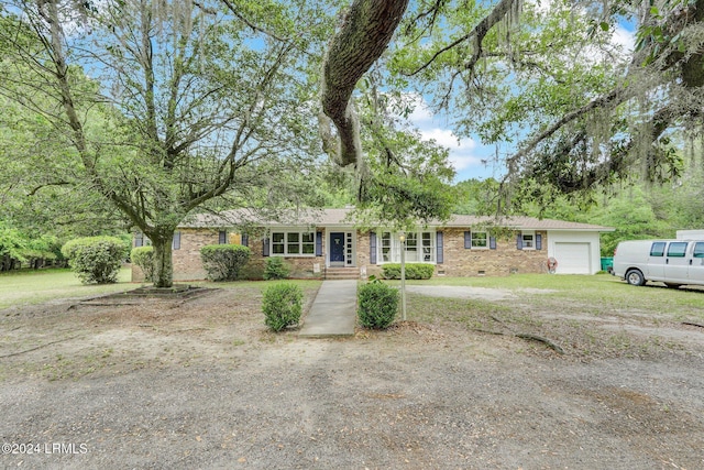 ranch-style home with a garage