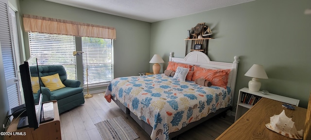 bedroom featuring wood-type flooring