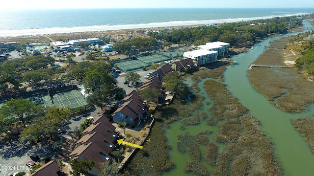 aerial view with a water view and a beach view