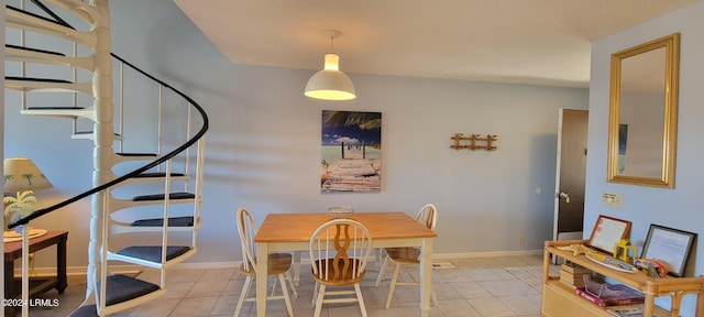 dining area featuring light tile patterned flooring