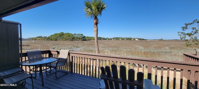 wooden terrace featuring a rural view