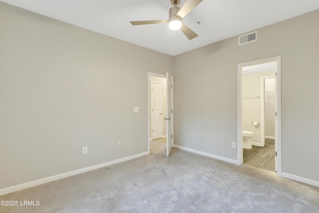 112 Union Cemetery Rd Unit 228, Hilton Head Island, SC 29926 - unfurnished bedroom featuring ensuite bathroom, a spacious closet, ceiling fan, light carpet, and a closet