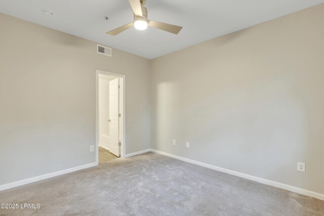 carpeted empty room with ceiling fan