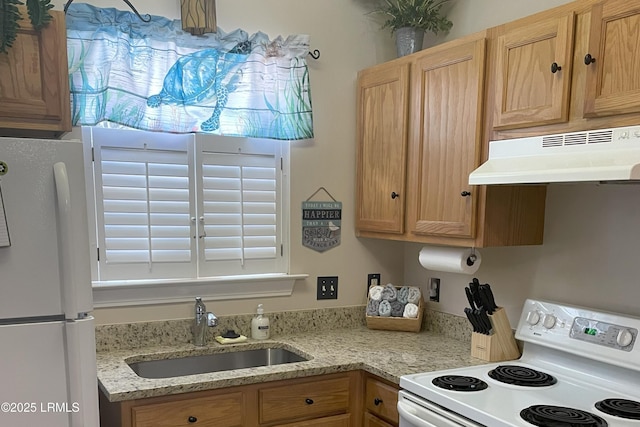 kitchen featuring sink and white appliances