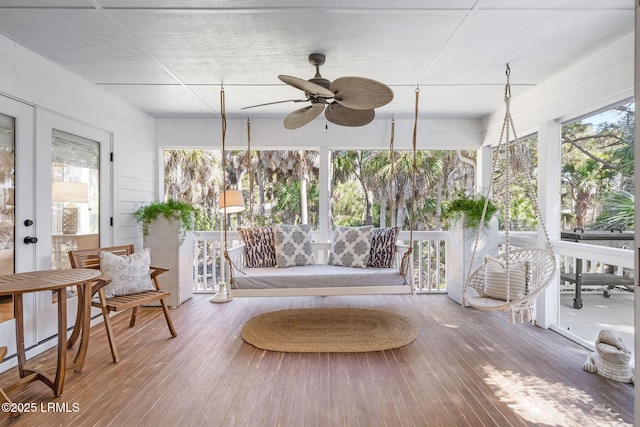 sunroom / solarium featuring ceiling fan, french doors, and a wealth of natural light