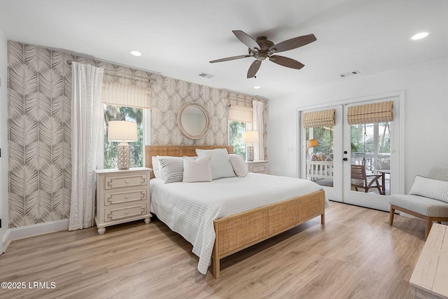 bedroom featuring access to outside, french doors, visible vents, and wallpapered walls