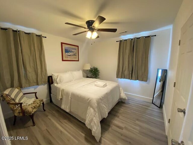 1712 Battery Park Dr, Port Royal, SC 29935 - bedroom featuring wood finished floors, baseboards, and a ceiling fan