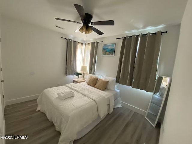 1712 Battery Park Dr, Port Royal, SC 29935 - bedroom with wood finished floors, baseboards, and a ceiling fan