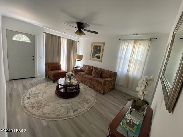1712 Battery Park Dr, Port Royal, SC 29935 - living room with light wood finished floors, a ceiling fan, and baseboards