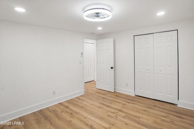 unfurnished bedroom featuring light wood-type flooring