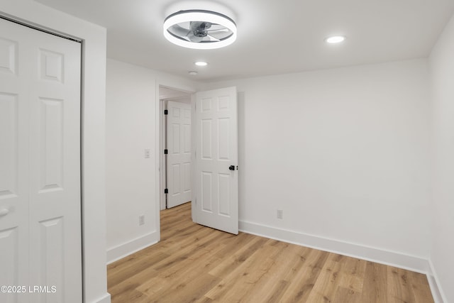 spare room featuring light hardwood / wood-style flooring