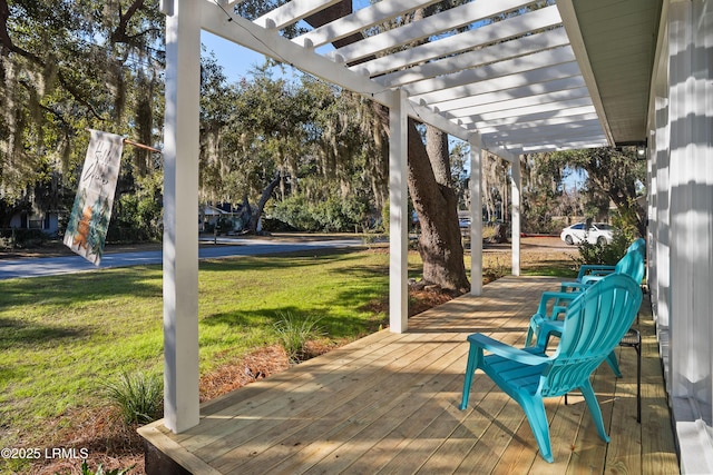 deck with a yard and a pergola