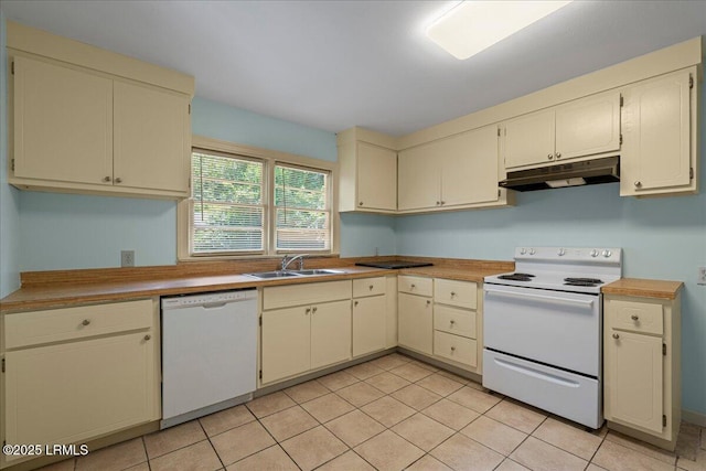 1803 Sixth St, Beaufort, SC 29902 - kitchen with white appliances, under cabinet range hood, light tile patterned floors, cream cabinets, and light countertops