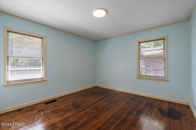 1803 Sixth St, Beaufort, SC 29902 - spare room with crown molding and dark wood-style flooring