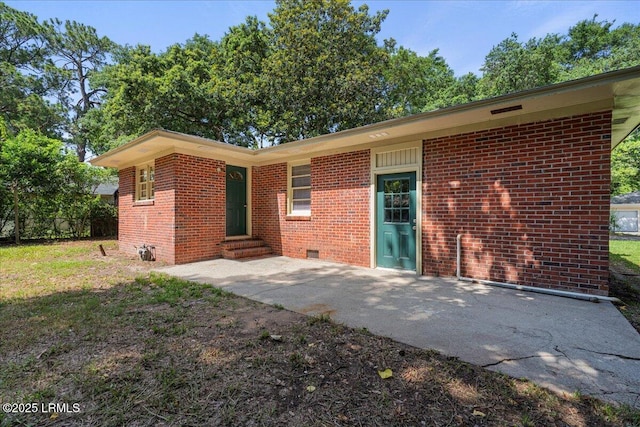 1803 Sixth St, Beaufort, SC 29902 - rear view of property with entry steps, brick siding, crawl space, and a patio