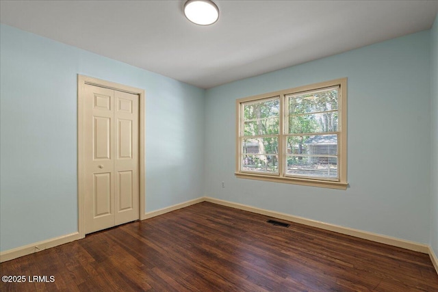 1803 Sixth St, Beaufort, SC 29902 - empty room featuring dark wood-style flooring and baseboards