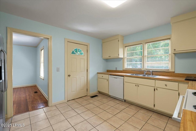 1803 Sixth St, Beaufort, SC 29902 - kitchen featuring dishwasher, plenty of natural light, range, and light tile patterned floors