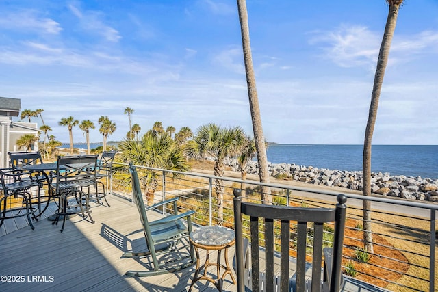 wooden deck featuring a water view