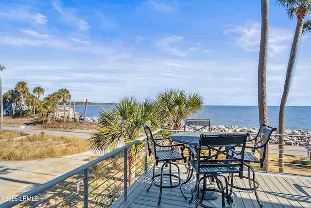 wooden deck featuring a water view