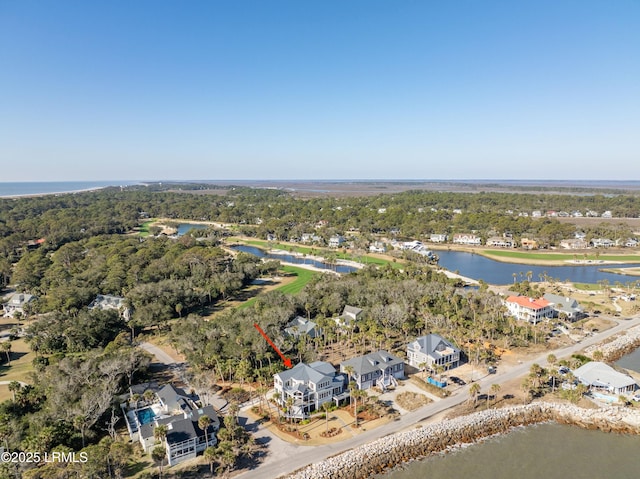 drone / aerial view featuring a residential view and a water view