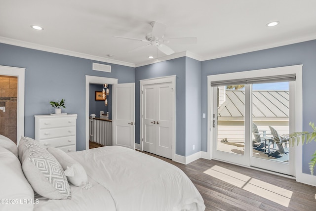 bedroom with dark wood-style floors, access to outside, visible vents, and crown molding